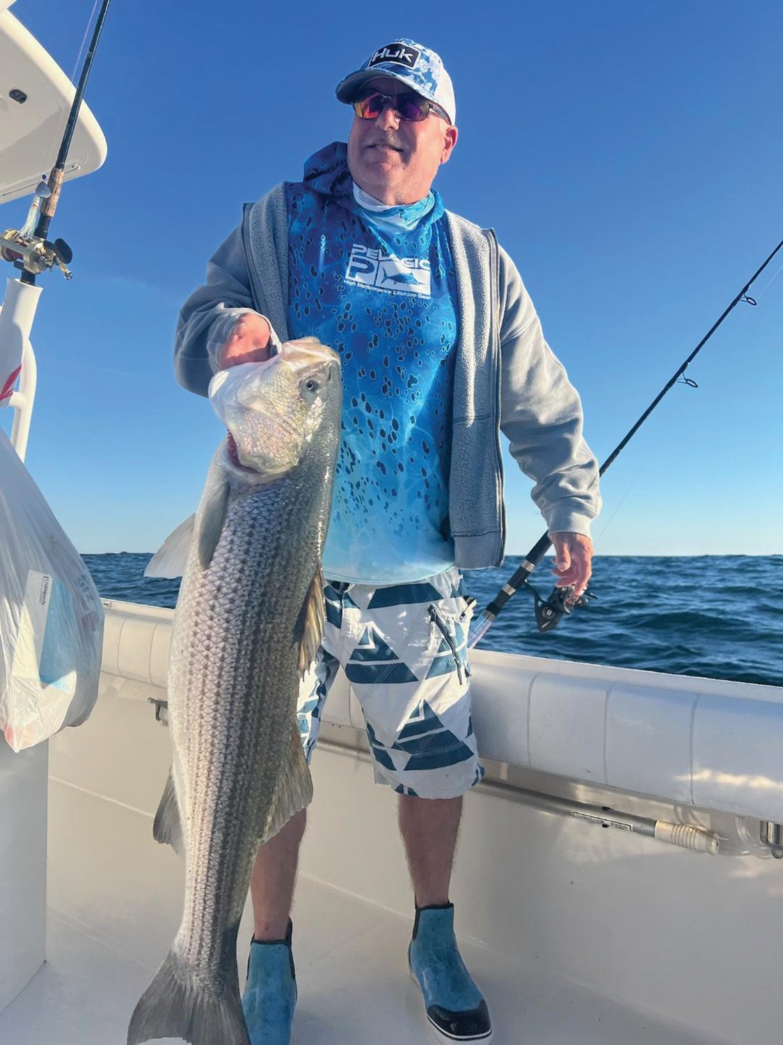 STRIPED BASS: Peter Johnson of Connecticut caught this striped bass while fluke fishing at Block Island. Peter said, “I caught it on 15 pound braid line as I was set up to catch fluke (summer flounder).” (Submitted photo)